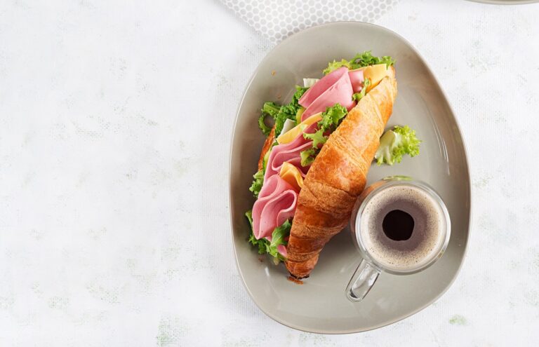 fresh-croissant-or-sandwich-with-salad-ham-and-ch-2022-10-12-16-47-33-utc-min.jpg