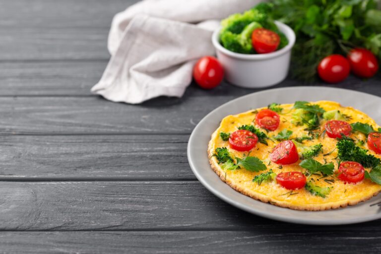 high-angle-breakfast-omelette-plate-with-tomatoes-broccoli-min